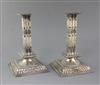 A pair of Victorian pierced silver square cluster column candlesticks by John Newton Mappin,                                           