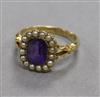 An early 20th century 18ct gold, amethyst and seed pearl dress ring, size M/N.                                                         