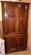 An oak corner cupboard H.212cm                                                                                                         