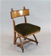 A Reformed Gothic oak dining chair, designed by Edward Welby Pugin, c.1864,                                                            