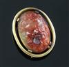 An early 20th century gold mounted oval agate clip brooch, gross 14.8 grams.                                                           