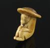 An 18th century Japanese stag horn netsuke of a monkey wearing a broad rimmed hat, depth 4cm height 4.75cm                             