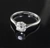 An 18ct gold and platinum cushion cut solitaire diamond ring, size M.                                                                  