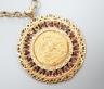 An 1892 gold sovereign, in a 9ct gold and garnet? set pendant mount on a 9ct gold chain, gross weight 29.2 grams.                                                                                                           