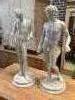 A pair of faux marble classical figures, larger 62cm high                                                                                                                                                                   