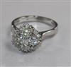 A modern 18ct white gold and diamond cluster ring size M.                                                                              