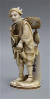 A Japanese ivory basket seller height 11cm                                                                                             