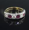 A modern 18ct gold, ruby and diamond seven stone half hoop ring, size Q.                                                               