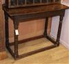 An oak side table W.107cm                                                                                                              