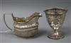 A George III demi fluted silver cream jug and sugar basket and a George III pierced silver sugar basket (no liner). 7.5 oz.            