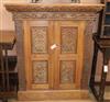 A carved oak 2-door cupboard W.104cm                                                                                                   