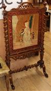 A Victorian walnut framed firescreen inset tapestry panel H.115cm                                                                      