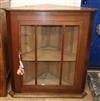 An oak glazed corner cabinet W.83cm                                                                                                    