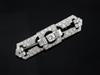 An Art Deco diamond and platinum openwork brooch, 47mm.                                                                                