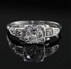 A 1930's/1940's platinum and single stone diamond ring, with diamond set shoulders size K.                                             