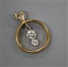 A 22ct gold wedding ring converted to a pendant and now set with two graduated diamonds, 26mm.                                         