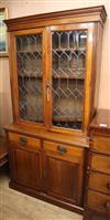 A late Victorian glazed walnut bookcase cupboard W.103cm                                                                               