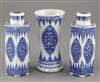 A pair of Chinese blue and white hexagonal jars and covers and a similar beaker vase                                                   