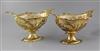 A pair of Edwardian silver gilt oval pedestal dessert baskets, by Herbert Charles Lambert, 56.5 oz.                                    