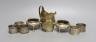 A George III silver cream jug, London, 1806, 10.6cm, a pair of Victorian silver bun salts and four silver napkin rings, 9oz.                                                                                                