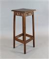 Attributed to Alfred Waterhouse. An oak jardiniere table, with moulded rectangular top and carved frieze, on W.1ft 3in.                