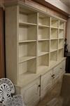 A George II style cream painted pine open bookcase cupboard W.310cm                                                                    
