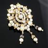 A Victorian style gold split pearl and diamond set oval drop pendant brooch, 63mm.                                                     