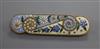 A yellow metal and floral enamel bar brooch, 52mm.                                                                                     