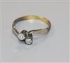 An 18ct gold and diamond two stone crossover ring, size M.                                                                             