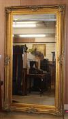 A large gilt-framed mirror H.218cm                                                                                                     