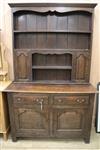 A 1920's oak dresser with plate rack over W.120cm                                                                                      