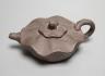 A Yixing clay teapot.                                                                                                                                                                                                       