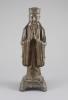 A Chinese bronze standing figure of an immortal, late Ming, 17th century, 31.3 cm high                                                                                                                                      