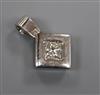 A white metal (stamped plat) and princess cut diamond set pendant, overall 18mm.                                                       