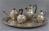 An early-mid 20th century Indian five piece white metal tea service with tea tray, gross 137oz.                                        