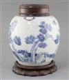 A Chinese 'Three Friends' blue and white ovoid jar, early 18th century, height 27cm including wood stand and cover                     