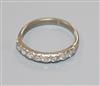 An 18ct white gold and eight stone diamond half eternity ring, size O.                                                                 