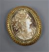 A yellow metal (tests as 18ct) and seed pearl mounted oval cameo brooch, carved with the bust of a lady to sinister, 51mm.             