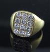 A late 1970's 18ct gold and pave set diamond tablet ring, size S/T.                                                                    