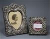 Two early 20th century repousse silver mounted photograph frames, one with heart shaped aperture, largest 19.4cm.                      