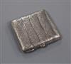 A 1950's Finnish 813 white metal cigarette case with samorodok decoration, 95mm.                                                       