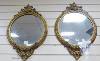 A pair of Victorian circular gilt wood and gesso wall mirrors. W-44, H-64cm.                                                                                                                                                