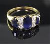 A gold, three stone sapphire and six stone diamond half hoop ring, size Q/R.                                                           