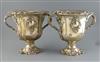 An ornate pair of 19th century Old Sheffield plate two handled pedestal wine coolers, H.26cm                                           