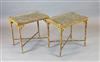 A pair of 20th century lacquered gilt faux bamboo occasional tables, W.1ft 10in. D.1ft 3in. H.1ft 9in.                                 