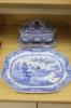 A blue and white meat dish decorated with a Chinese landscape pattern, and a Victorian blue and white tureen, cover and stand, height 17cm                                                                                  