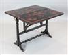 An unusual Victorian ebonised Sutherland table, W.2ft 10in. H.2ft 2in.                                                                 