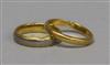 A 22ct gold wedding band and a two colour 18ct gold band.                                                                              