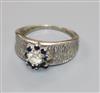 An 18ct white gold, and gem set cluster ring, size O.                                                                                  