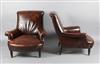 A pair of French leather club armchairs                                                                                                